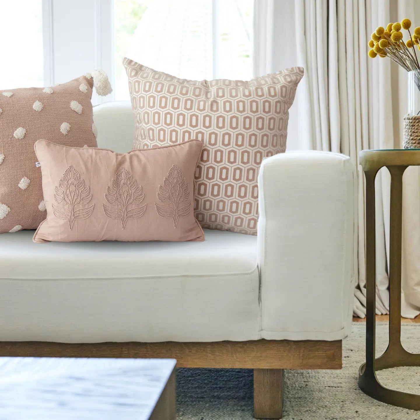 Odette hex rose floral pillow cover on neutral sofa
